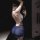 Woman in mannyqing lace necktie lingerie set, sheer cross-back bra and panty set, taking a mirror selfie.