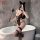 Woman in black lace feiniao moon gazer bodysuit with cat ears, posing by bathtub holding feather wand for valentine’s romance...