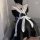 A maid costume dress featuring a black and white design with ruffled details, perfect for anime cosplay or lolita style event...