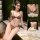 Woman modeling leopard print halter lingerie set with tie-back detail, showcasing comfortable and sexy sleepwear design.
