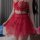 Woman wearing a red sexy uniform-inspired lingerie set with a no-remove bra and matching outfit, featuring intricate lace det...