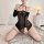 Woman kneeling in a sexy sheer black bodycon lace corset dress with straps, styled as a seductive boudoir outfit.