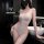 Woman wearing white lace bodysuit with cut-outs and backless design, romantic lingerie set for sleepwear.