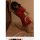 Woman in red vintage-style lace corset set, retro qipao-inspired lingerie with side buckles, posing seductively on bed.