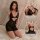Woman wearing black lace sheer cami nightgown with mesh details, elegant lingerie set for sleep or play.