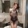 Sexy lace bodysuit with sheer mesh design, thigh-high black stockings, perfect for seductive sleepwear set.