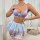 Model wearing european-style purple lace lingerie set with bra, sheer skirt & bows.