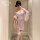 Woman in mirror wearing feimu japanese-style seductive side-open thong set — revealing cheeky 3-piece lingerie with no-remove...
