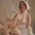 Woman modeling manny night leopard print cat girl lingerie set with hood, gloves, and 3-piece role play outfit.