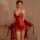 Woman wearing red manyan lingerie set with lace cami dress, sheer gown, and robe for sensual sleepwear.