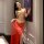 Golden metallic bikini top paired with sheer red lace skirt, elegant design perfect for women seeking allure and sophisticati...
