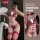 Woman modeling red and black lace lingerie set with pearl details, featuring deep v bra, garter belt, and thong for romantic ...