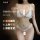 Woman modeling white pearl-embellished lace lingerie set with sheer straps and ruffles, part of a seductive 3-piece sleepwear...