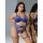Woman modeling qimengya blue lace thong set with thigh rings, seductive 3-piece lingerie for intimate wear.