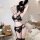 Woman wearing qingruohan black lace lingerie set with bunny ears and heart mask in cozy bedroom setting.
