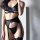 Seductive leather-look lingerie set featuring sexy lace-up design, perfect for an elegant and daring look.