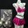 Shiny pink lingerie set with bra, pleated skirt, and black harness on mannequin.