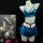 Shiny blue lingerie set with bra, pleated skirt, and black harness on mannequin.