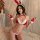 Woman wearing red and white bunny costume with ears, gloves, and bikini-style top and bottom for christmas cosplay.