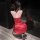 A woman kneels facing away from the camera, wearing a red satin chaomu rose lace tie-up lingerie set with black stockings and...