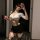 A woman poses with a whip, wearing a white crop top and black mini skirt from the qqny seductive secretary outfit. the ensemb...