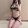 Woman modeling black cross-border lingerie set with underwire bra, bondage straps & thigh rings – 4-piece european export col...