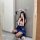 A person wearing a cute bunny headband, taking a mirror selfie. theyre dressed in a playful school uniform outfit featuring a...