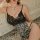 Seductive sheer black lace top paired with leopard print open-crotch sleepwear, elegant and daring design for pure allure.
