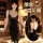 Sexy black lace cami dress with deep v neckline and thigh-high stockings, perfect for evening wear or sleepwear.
