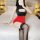 A woman poses on a bed wearing a black and red ranqing seductive lingerie set, featuring a hot sheer office secretary outfit ...