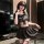 A stylish woman poses confidently wearing a chic black jk-style outfit featuring a pleated skirt and matching bra, perfect fo...