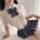 Sexy schoolgirl style sheer blouse with plaid bow tie and pleated skirt, perfect for bold fashion statements.