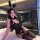 A woman poses in a black bunny-themed lingerie set, featuring lace details and stockings, perfect for a couples date night.