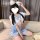 A person wearing a cute schoolgirl uniform set featuring a white crop top with blue accents, a matching mini skirt, and fluff...