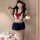 Sexy schoolgirl costume set featuring a short navy skirt, sailor top with red bow, perfect for adults seeking pure and tempti...