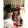 A woman poses playfully wearing a cute kitty cat maid costume set, featuring a black and white dress with pink accents and a ...