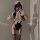 A woman poses in a black maid costume set featuring lace details, stockings, and a sailor hat, perfect for cosplay or themed ...
