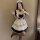 Japanese maid costume dress featuring a cute lolita style with ruffles and bows, perfect for cosplay or daily wear.