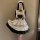 Japanese maid costume dress featuring a cute lolita style with ruffles and lace details, perfect for cosplay or daily wear.