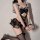 Sexy black cat-ear maid costume with open-crotch design, featuring lace details and stockings for seductive allure.