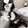 A woman poses wearing a yimenglan sexy lingerie set, featuring a maid-style uniform with black and white colors, ruffled deta...