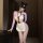 Sexy maid costume featuring lace sheer bodysuit with open-crotch design, perfect for women seeking bold fashion statement.