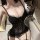 Woman wearing black lace rabbit girl lingerie set with underwire bra, padded cups, and fishnet gloves.