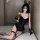 Model wearing black rabbit girl lingerie set with underwire bra, fishnets, and bunny ears.
