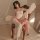 A woman sits elegantly on an antique chair, wearing a sheer vintage-chic sleepwear set. the set features a delicate floral de...