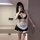 Woman wearing suoqing maid costume set — cute 6-piece lingerie outfit with ruffles, apron, garters & bow choker. soft, playfu...