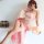 A woman poses elegantly in a sheer chiffon dress inspired by chinese hanfu, featuring a delicate floral design and a flowing ...
