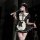 A woman poses in a black and white maid outfit, featuring lace details and a feathered wand accessory, embodying a seductive ...