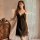 Elegant black lace-trimmed satin sleep dress with adjustable straps, perfect for pure sensuality and comfort.