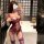 A woman poses in a luxurious bathroom wearing a purple lace lingerie set, featuring garter straps and stockings, perfect for ...